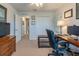 Bedroom with neutral carpeting features desk, storage, and closet; versatile space for work or rest at 87 Delacorte Way, Oviedo, FL 32765