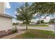 Landscaped front yard with brick sidewalks, lawn, and a view of the neighborhood at 87 Delacorte Way, Oviedo, FL 32765