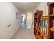 Second floor hallway with views to staircase, storage and an open floorplan at 87 Delacorte Way, Oviedo, FL 32765
