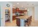 Modern kitchen with granite countertops, stainless steel appliances, and pantry space at 87 Delacorte Way, Oviedo, FL 32765