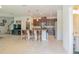 Open-concept living area featuring a kitchen island, and great natural light at 87 Delacorte Way, Oviedo, FL 32765