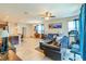 Open living space featuring tile floors, lots of light and a comfortable place to relax at 87 Delacorte Way, Oviedo, FL 32765