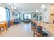Bright and airy living room flows from kitchen with barstool seating and open floor plan at 87 Delacorte Way, Oviedo, FL 32765