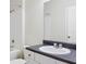 Well-lit bathroom featuring a shower, tub, and a white sink with a dark countertop at 8824 Villa View Cir # 204, Orlando, FL 32821
