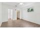 Open bedroom with a ceiling fan, closet, and laminate floors at 8824 Villa View Cir # 204, Orlando, FL 32821