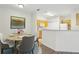 Dining area with seating for four and a view into the kitchen at 8824 Villa View Cir # 204, Orlando, FL 32821
