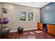 Bright exercise room with hardwood floors, natural light, and fitness equipment at 8824 Villa View Cir # 204, Orlando, FL 32821