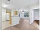 Open-concept living space, connecting the living room and kitchen with hardwood floors at 8824 Villa View Cir # 204, Orlando, FL 32821