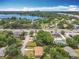 Aerial showcases a neighborhood property near a body of water at 920 Gloriosa Ave, Winter Park, FL 32789
