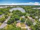 Aerial view of a cozy home nestled within a neighborhood near a serene lake at 920 Gloriosa Ave, Winter Park, FL 32789
