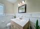 Clean bathroom with a bright mirror, white tiled walls, and a stylish vanity at 920 Gloriosa Ave, Winter Park, FL 32789