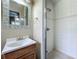 Bathroom showcasing a glass enclosed walk-in shower and classic sink and mirror at 920 Gloriosa Ave, Winter Park, FL 32789