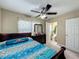 Bedroom showcasing a modern bed set, dresser with mirror, and an attached bathroom at 920 Gloriosa Ave, Winter Park, FL 32789