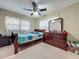 Spacious bedroom featuring dark wood furniture, a large window and carpeted floors at 920 Gloriosa Ave, Winter Park, FL 32789