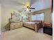 Cozy bedroom featuring a decorative bed frame, dresser, and a ceiling fan at 920 Gloriosa Ave, Winter Park, FL 32789