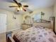 Comfortable bedroom showcasing a decorative headboard, dresser with a mirror, and a ceiling fan at 920 Gloriosa Ave, Winter Park, FL 32789