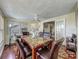 Cozy dining area featuring a decorative table, fan, and natural light from the windows at 920 Gloriosa Ave, Winter Park, FL 32789