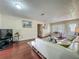 Bright living room with wood floors and a comfortable seating arrangement near the entry door at 920 Gloriosa Ave, Winter Park, FL 32789