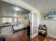 Open-concept living room with wood floors, white sofa and view to the front door at 920 Gloriosa Ave, Winter Park, FL 32789