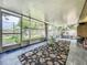 Spacious sunroom featuring updated flooring, ample natural light, and backyard access at 920 Gloriosa Ave, Winter Park, FL 32789