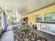 Inviting sunroom perfect for relaxation, with backyard views and ample space for furniture at 920 Gloriosa Ave, Winter Park, FL 32789