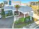 Exterior front view of Ocean Jewels Club in Daytona Beach Shores, with lush tropical landscaping and signage at 935 S Atlantic Ave # 355, Daytona Beach, FL 32118