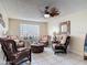 Comfortable resident sitting area with tile floors, ceiling fan, and abundant natural light at 935 S Atlantic Ave # 355, Daytona Beach, FL 32118