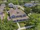 Charming home with a large porch, mature trees, and manicured lawn at 10100 Loblolly Pine Cir, Orlando, FL 32827