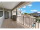 Spacious tiled balcony with white railings and neighborhood views at 10100 Loblolly Pine Cir, Orlando, FL 32827