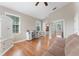 Bright bedroom with hardwood floors, natural light, and a mirrored closet with an attached bathroom at 10100 Loblolly Pine Cir, Orlando, FL 32827