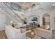 Bright living room with a two story ceiling, an open layout, and plenty of space for entertaining at 10100 Loblolly Pine Cir, Orlando, FL 32827