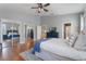 Spacious main bedroom with a ceiling fan, hardwood floors, and mirrored closet doors at 10100 Loblolly Pine Cir, Orlando, FL 32827