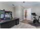 Office space with desk, chair and view to exercise equipment at 10100 Loblolly Pine Cir, Orlando, FL 32827