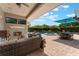 Expansive patio with outdoor fireplace, dining area, and view of the pool at 10100 Loblolly Pine Cir, Orlando, FL 32827
