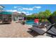 Inviting pool area with lounge chairs, and an outdoor dining set under an umbrella at 10100 Loblolly Pine Cir, Orlando, FL 32827