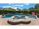 Gorgeous pool and spa surrounded by lush landscaping, offering a private retreat at 10100 Loblolly Pine Cir, Orlando, FL 32827