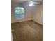 Cozy bedroom with a neutral color palette, a window, and carpeted floors at 1051 S Hiawassee Rd # 2136, Orlando, FL 32835