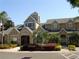Charming clubhouse with well-maintained landscaping, architectural detail, and ample parking at 1051 S Hiawassee Rd # 2136, Orlando, FL 32835