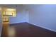 Open-concept living space leading to a kitchen with updated appliances and tile backsplash at 1051 S Hiawassee Rd # 2136, Orlando, FL 32835