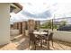 Inviting backyard patio with brick pavers, a dining set, and a serene ambiance for relaxation at 109 Kenny Blvd, Haines City, FL 33844