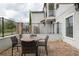 Cozy backyard patio features brick pavers and a charming outdoor dining set perfect for entertaining at 109 Kenny Blvd, Haines City, FL 33844