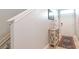 Inviting foyer features a decorative table, neutral walls, and easy access to the staircase and front door at 109 Kenny Blvd, Haines City, FL 33844