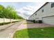 Exterior view of townhomes with brick driveways and well-maintained landscaping at 109 Kenny Blvd, Haines City, FL 33844