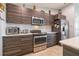Modern kitchen boasting stainless steel appliances, wood cabinets, and white subway tile backsplash at 109 Kenny Blvd, Haines City, FL 33844
