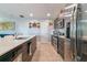 Modern kitchen boasting stainless steel appliances, wood cabinets, and white countertops at 109 Kenny Blvd, Haines City, FL 33844