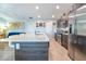 Modern kitchen with stainless steel appliances, large island, and sleek cabinets at 109 Kenny Blvd, Haines City, FL 33844