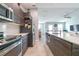 Modern kitchen boasting stainless steel appliances, wood cabinets, and white subway tile backsplash at 109 Kenny Blvd, Haines City, FL 33844