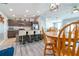 Bright kitchen featuring stainless steel appliances, a large island with seating, and a dining area at 109 Kenny Blvd, Haines City, FL 33844