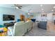 Open concept living area features sleek flooring, a ceiling fan, and an eat in kitchen area at 109 Kenny Blvd, Haines City, FL 33844