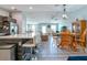Open-concept living room connected to kitchen and dining area with modern decor and natural light at 109 Kenny Blvd, Haines City, FL 33844